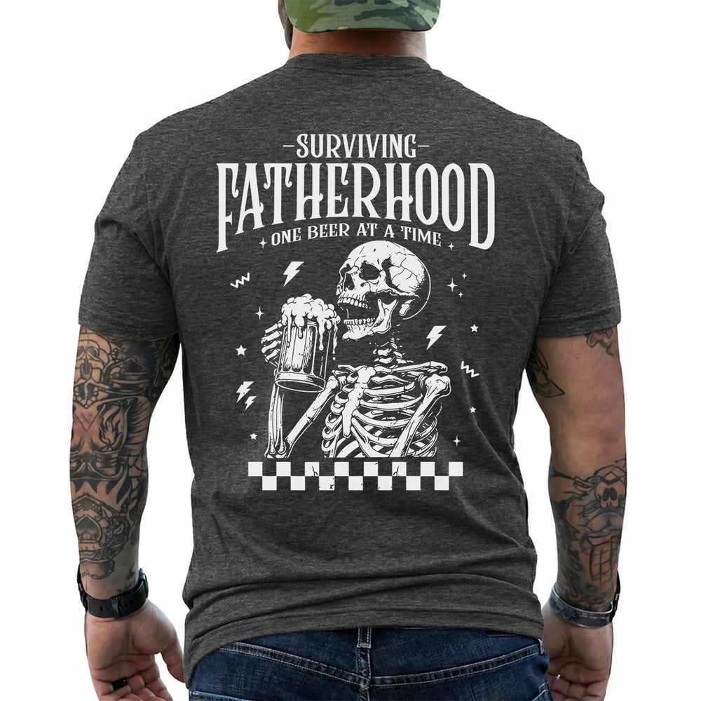Surviving Fatherhood One Beer at a Time Skeleton Graphic Tee – Funny Dad Life Shirt